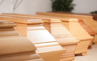 wooden funeral caskets sitting at crematory