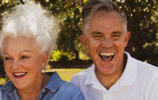 older man and woman laughing in park near Encino, CA