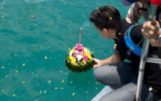 family placing loved ones ashes into Pacific ocean near Santa Barbara coast