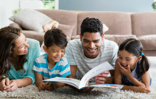 parents reading books about coping with death and grief to their young kids